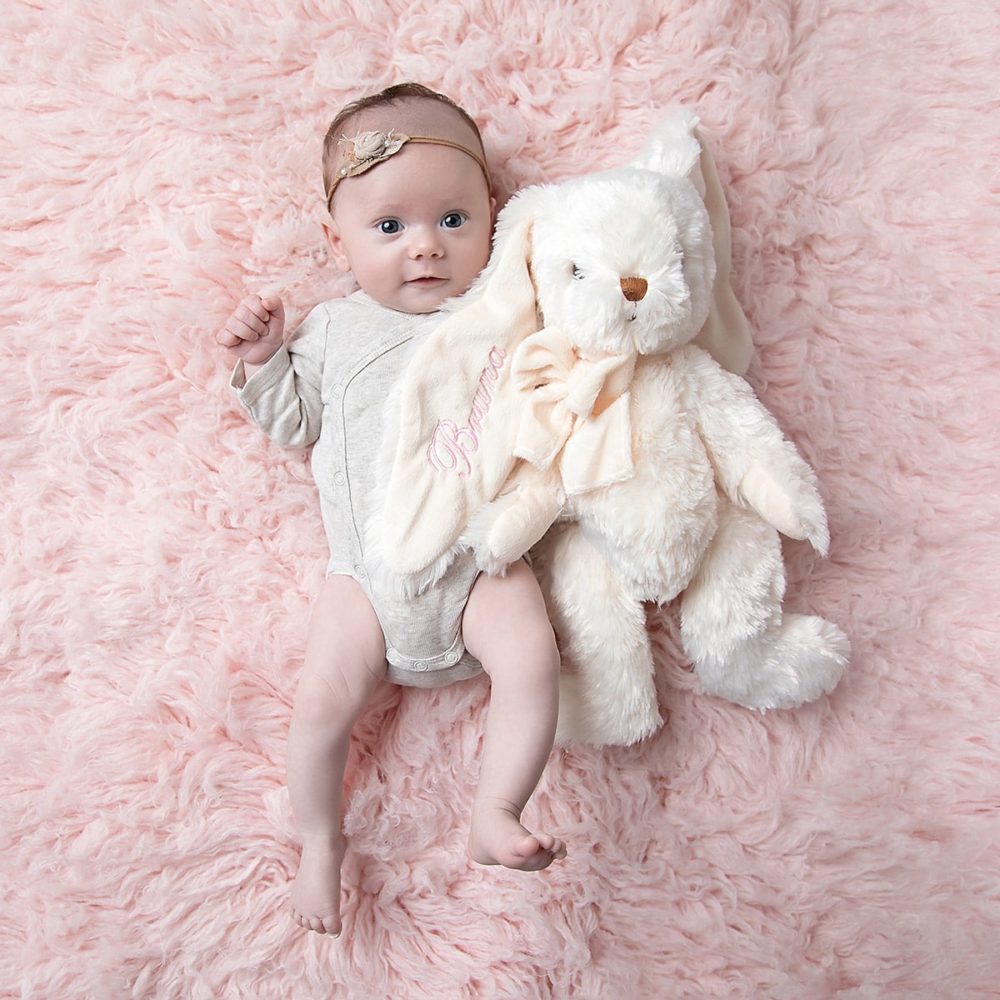 Baby with stuffed animal with name