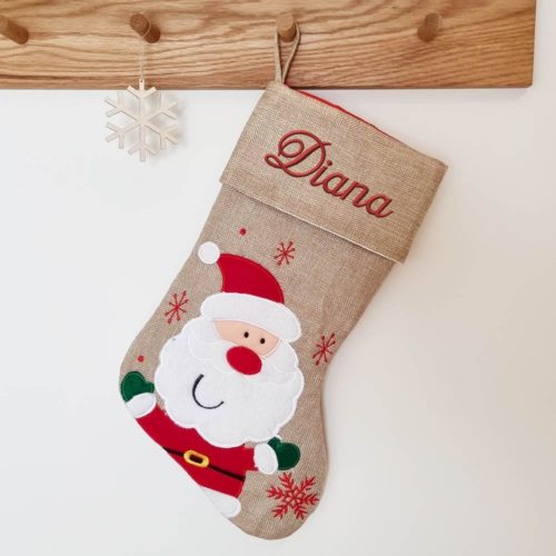 Brown Christmas stocking with happy Santa