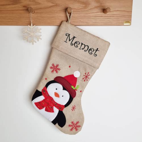 Brown woven Christmas stocking with penguin