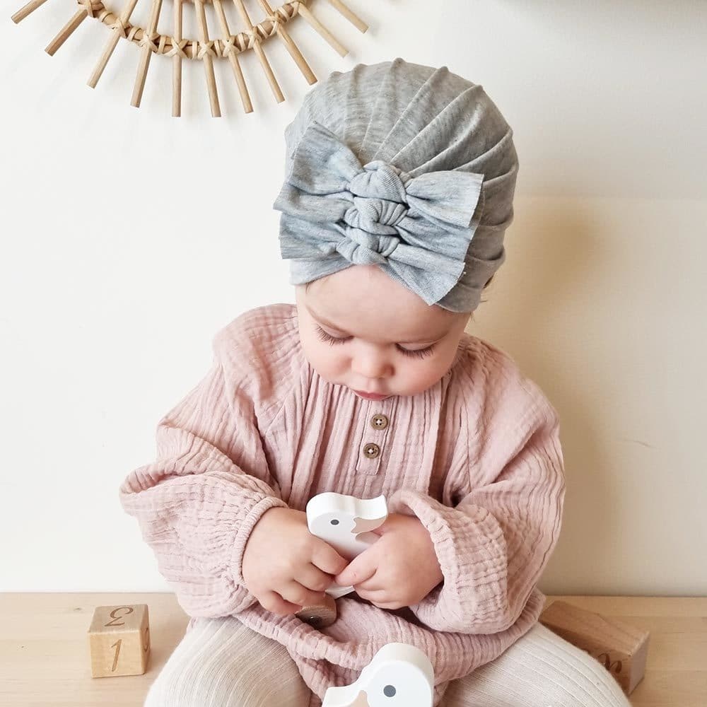 Baby with gray turban