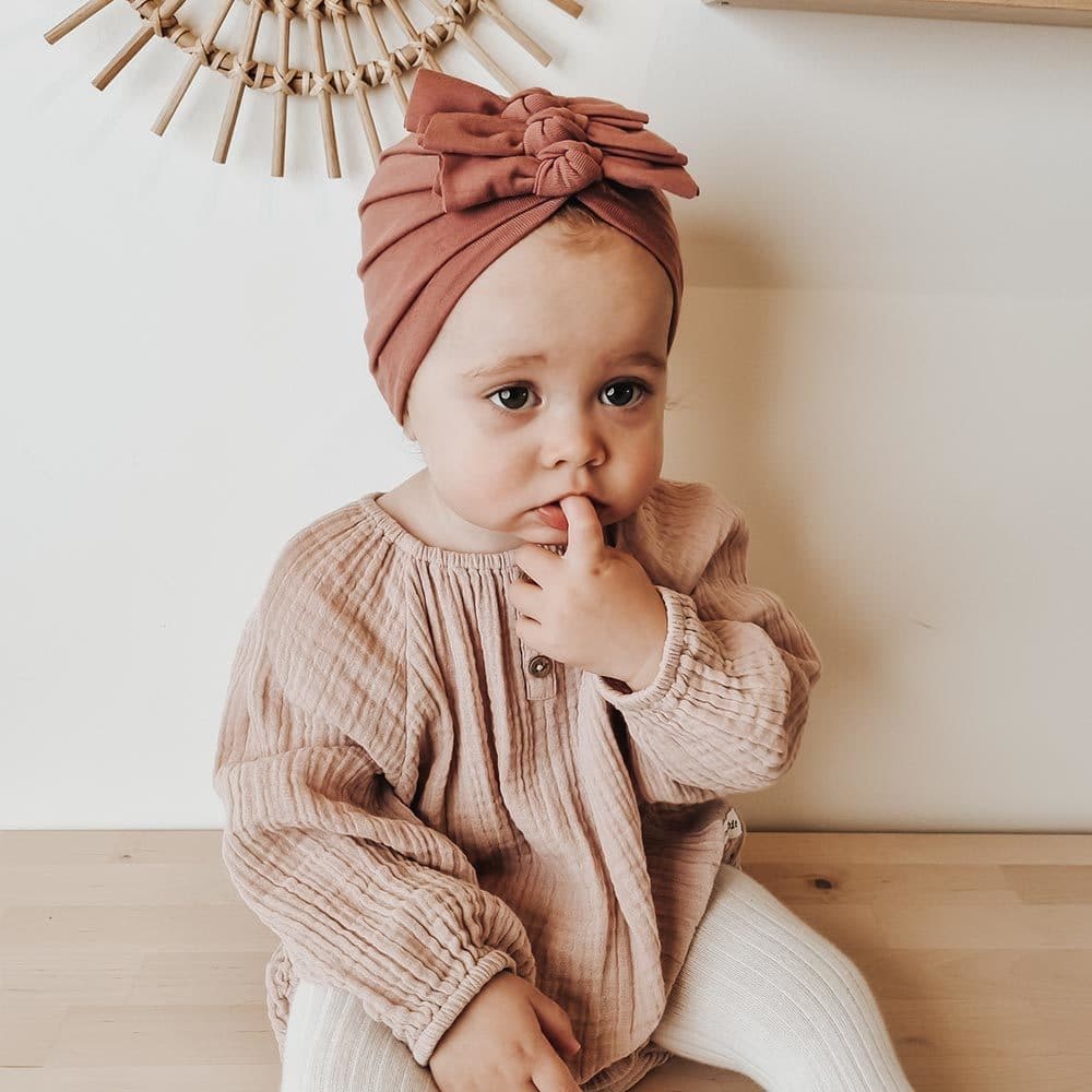 Baby's turban medium pink seen from the front